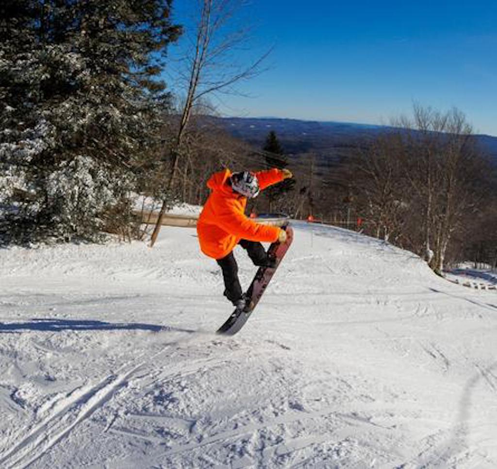 snowboarder tail butter at bromley mountain